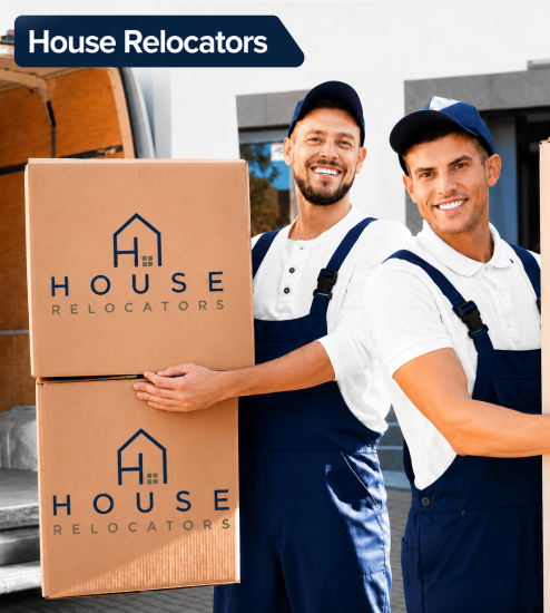 Two movers carrying House Relocators branded boxes beside a removal van